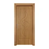 A warm-toned wooden door featuring a flowing, carved design that mirrors musical notes.