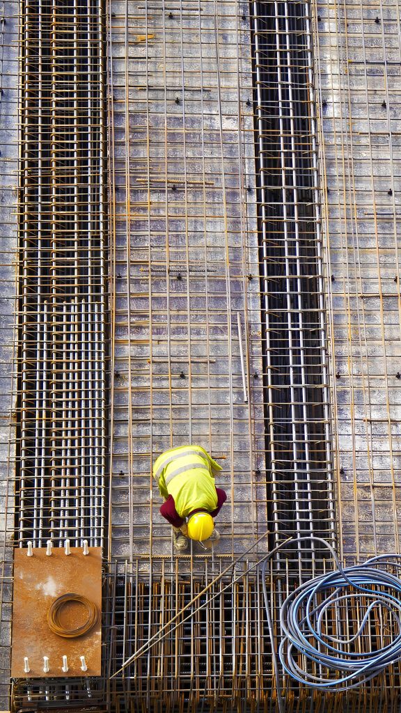workers putting metal structure construction 1 1